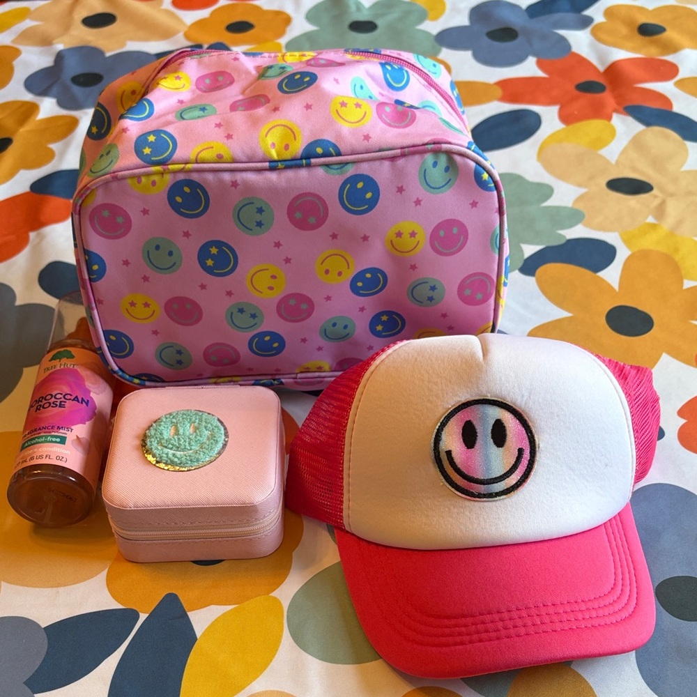 Pink Smiley Face Hat, Cosmetic Bag, Jewelry Holder and Tree Hut Spray.